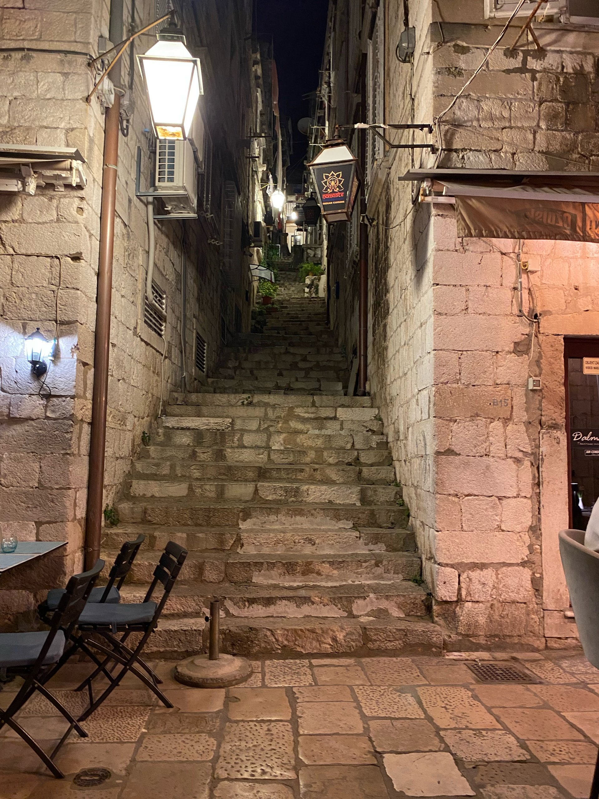 A stone stairway in Dubrovnik old town lit at night