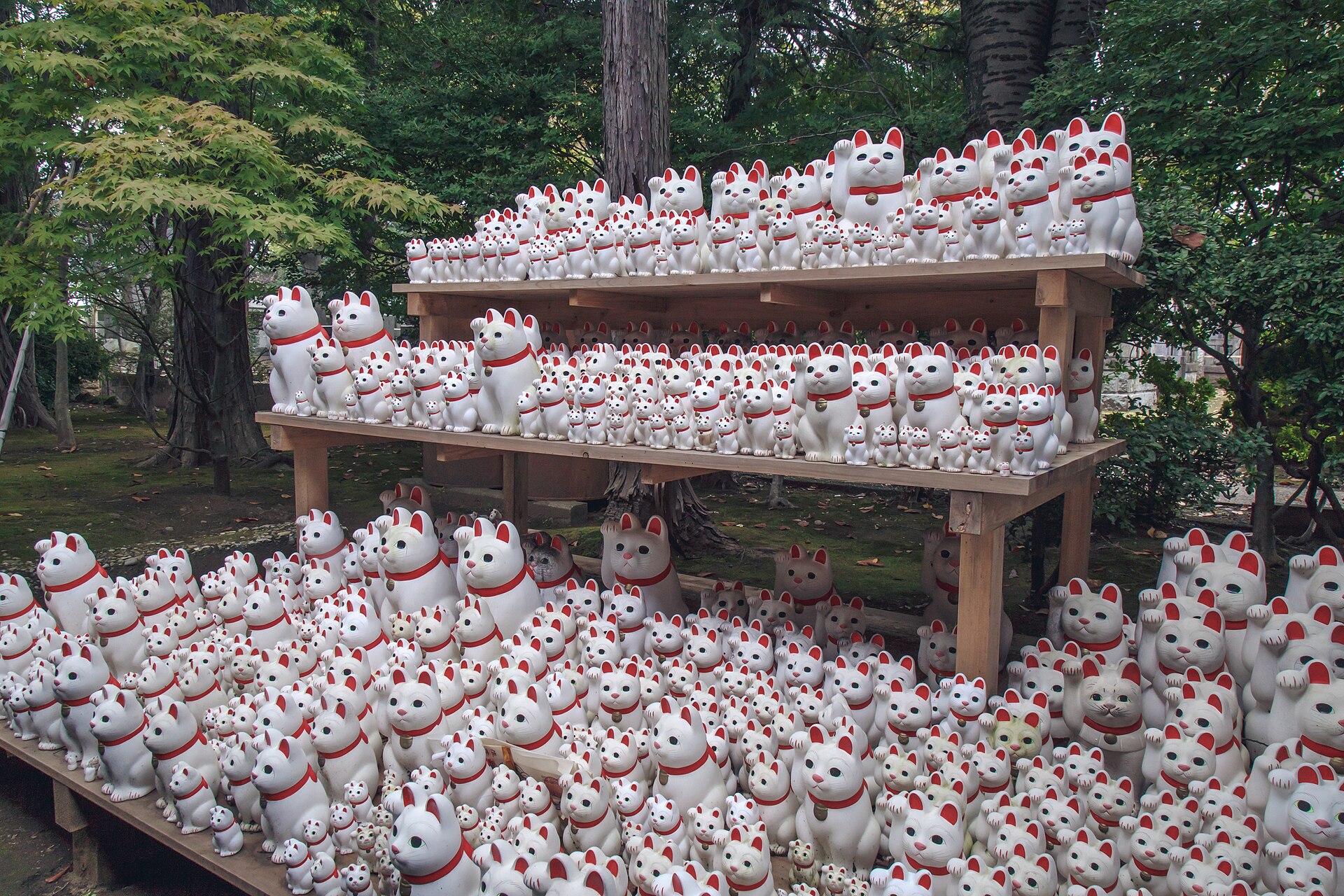 Lucky cat figurines of every size left as offerings at Gotokuji