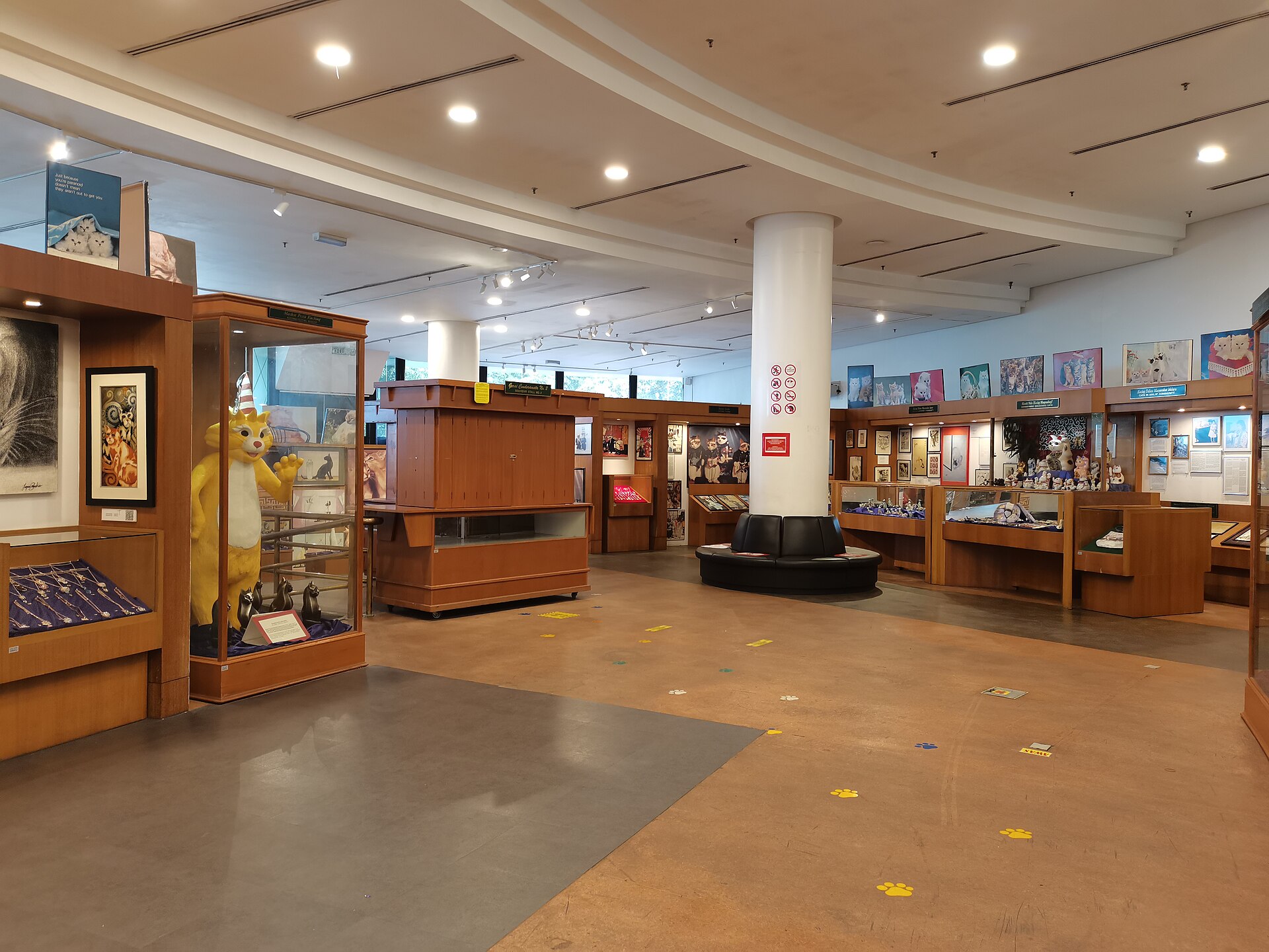 Inside the Kuching Cat Museum, cases of cat objects from around the world