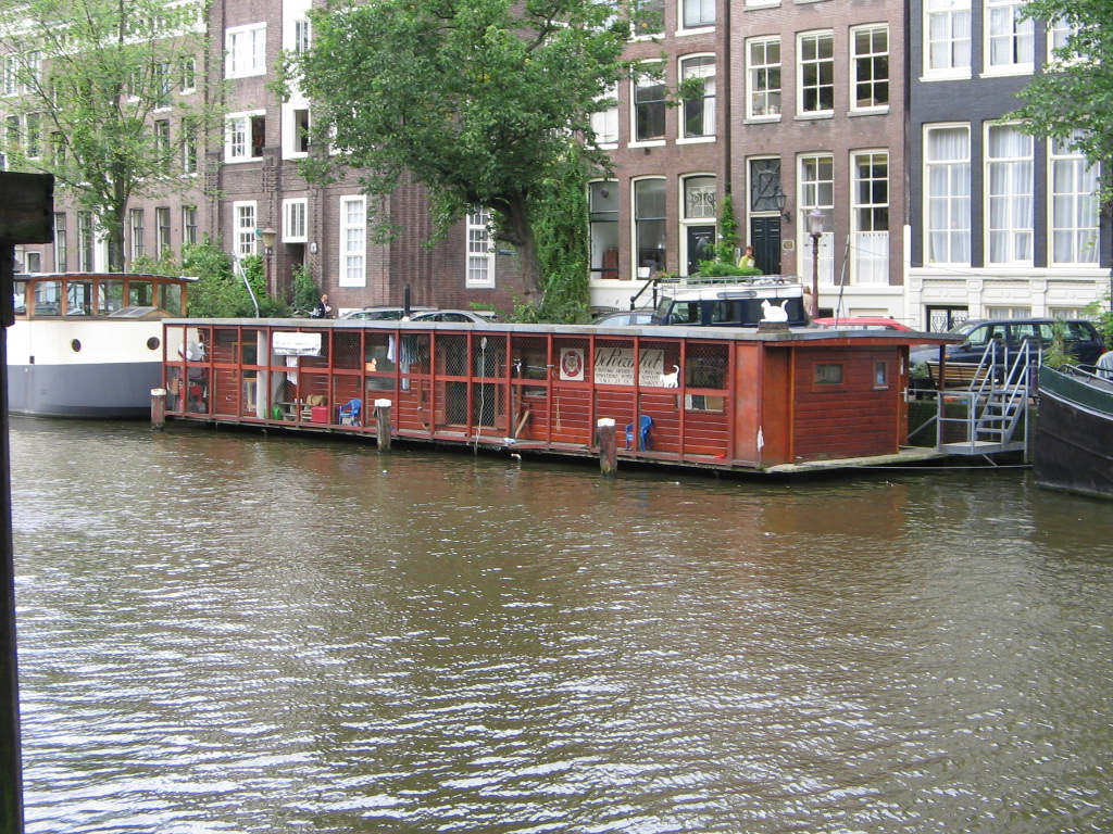 The exterior of De Poezenboot, the cat boat, on an Amsterdam canal