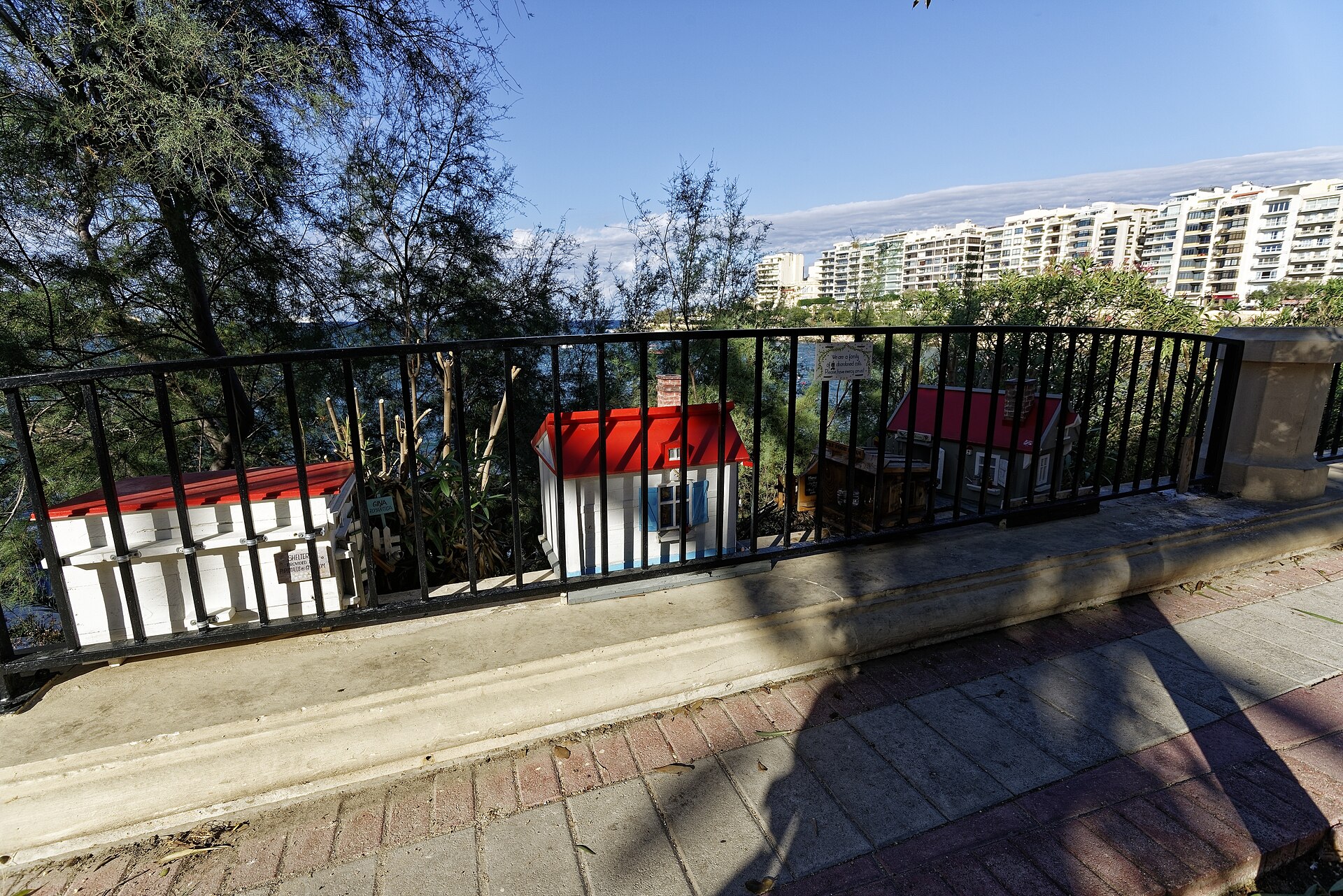The cat village on Tower Road in Sliema, small painted shelters for cats on a seafront garden